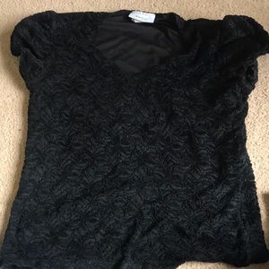 This is a black blouse with puffy short sleeve, it is from Dressbarn women.